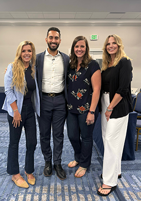 Photo of attorneys attending AI conference for lawyers